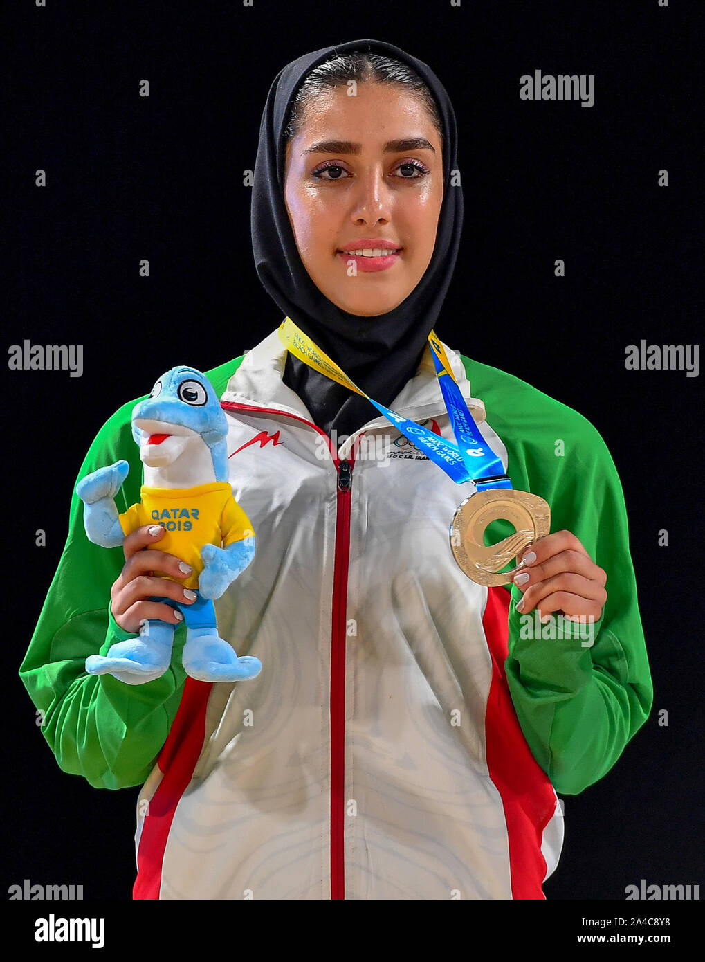 Doha, Qatar. 13th Oct, 2019. Fatemeh Sadeghi of Iran poses for photos during the medal ceremony of women's individual Kata event at the ANOC World Beach Games in Doha, Qatar, Oct. 13, 2019. Credit: Nikku/Xinhua/Alamy Live News Stock Photo