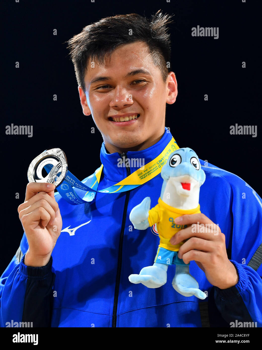 Doha, Qatar. 13th Oct, 2019. Wang Yi of Chinese Taipei poses for photos during the medal ceremony of men's individual Kata event at the ANOC World Beach Games in Doha, Qatar, Oct. 13, 2019. Credit: Nikku/Xinhua/Alamy Live News Stock Photo