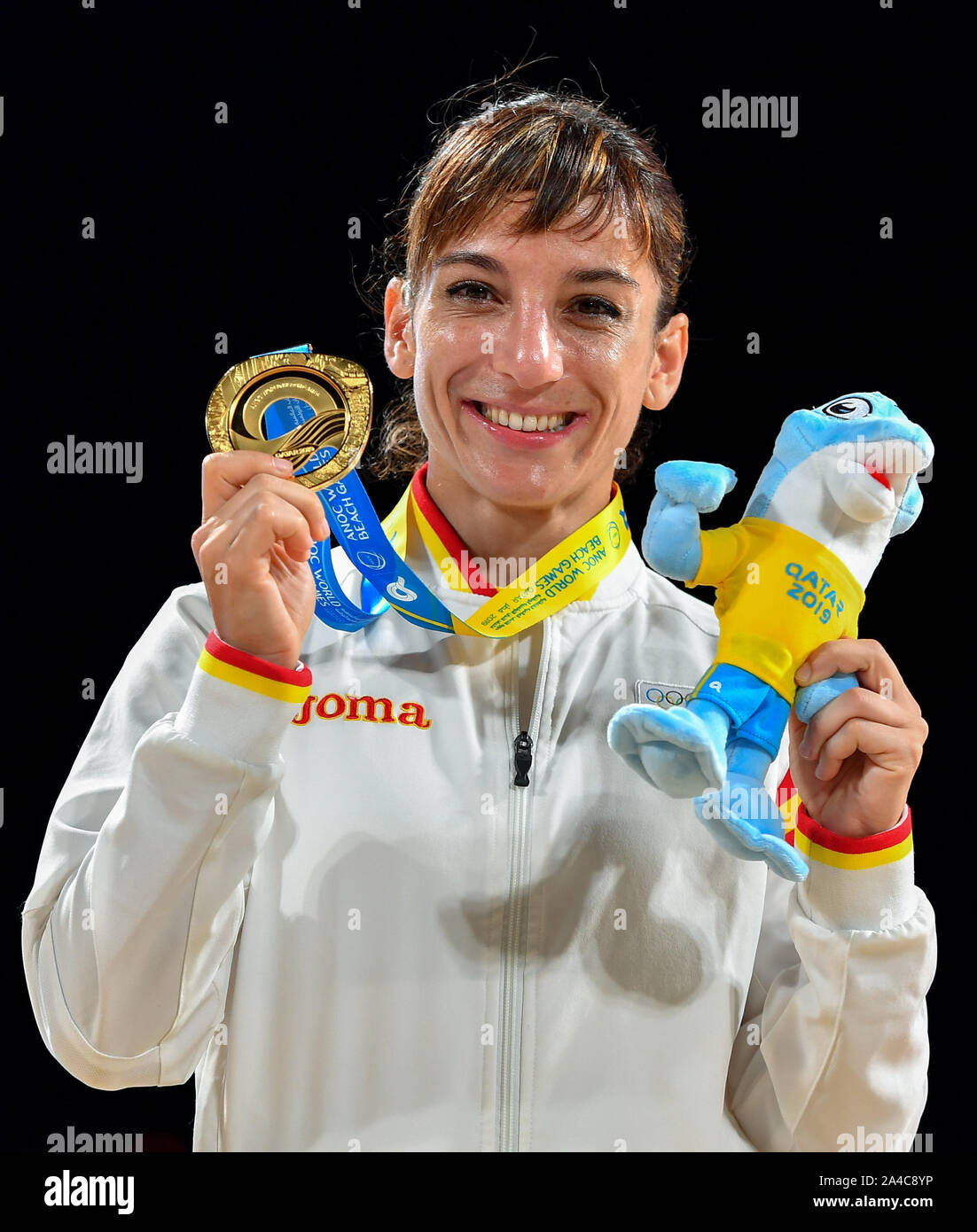 Doha, Qatar. 13th Oct, 2019. Sandra Sanchez of Spain poses for photos during the medal ceremony of women's individual Kata event at the ANOC World Beach Games in Doha, Qatar, Oct. 13, 2019. Credit: Nikku/Xinhua/Alamy Live News Stock Photo