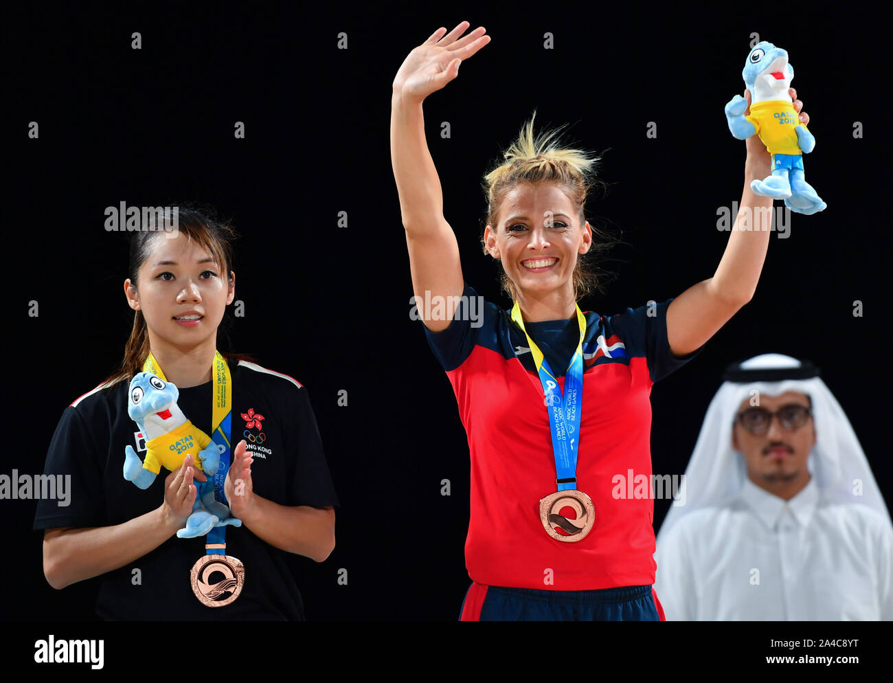 Doha, Qatar. 13th Oct, 2019. Maria Dimitrova (C) of the Dominican Republic poses for photos during the medal ceremony of women's individual Kata event at the ANOC World Beach Games in Doha, Qatar, Oct. 13, 2019. Credit: Nikku/Xinhua/Alamy Live News Stock Photo