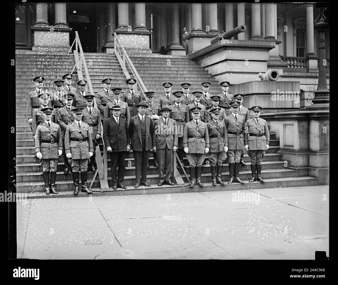 The Secretary of War, The Hon. Dwight Davis, and the Chief of Staff, the Deputy Chief of Staff, the assistants Chief of Staff, and the Chiefs of branches posed for a photograph on the steps of the war Dept. In the group left to right, front row, Major Gen. Frank Parker, Major Gen. Charles P. Summerall, Chief of Staff, Assistant Secretary of War, Col. C.B. Robbins, Secretary of War, Dwight F. Davis, Major Gen, B.H. Wells, Deputy Chief of Staff, Brig. Gen. E.E. Booth, Ass't Chief of Staff, Major Gen. Fred T. Austin, Chief of Field Artillery, Major Gen. A.L. Carmichael, Chief of Finance Stock Photo