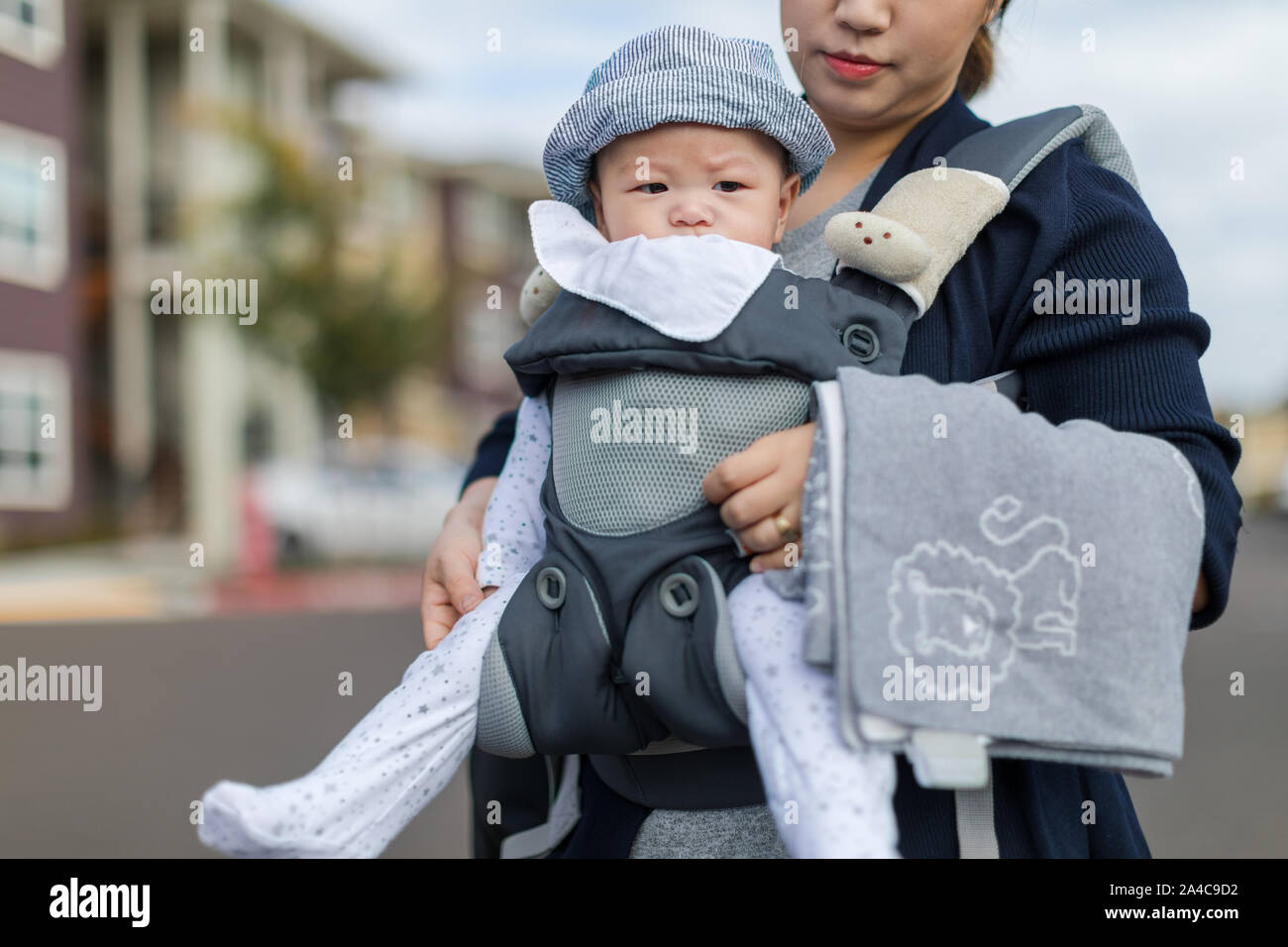 Blue baby carrier hi res stock photography and images Page 3 Alamy
