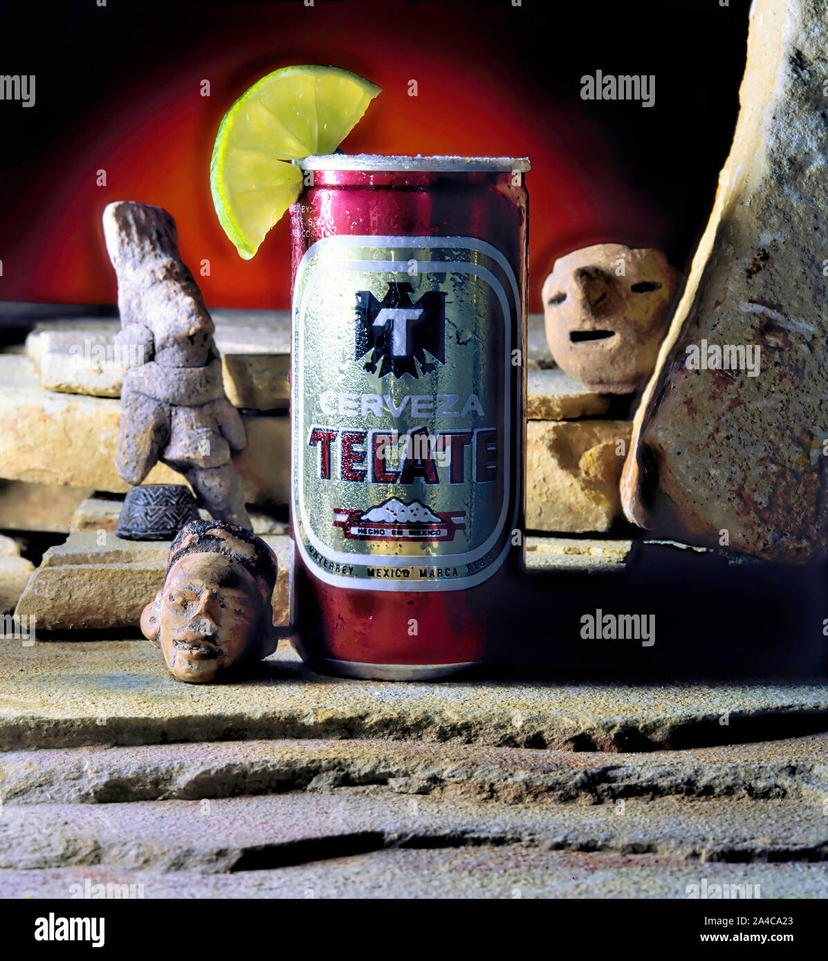 Dallas,Texas - Oct.13,2019 - Cold Tecate beer with Mexican Pre Columbian figures. Stock Photo