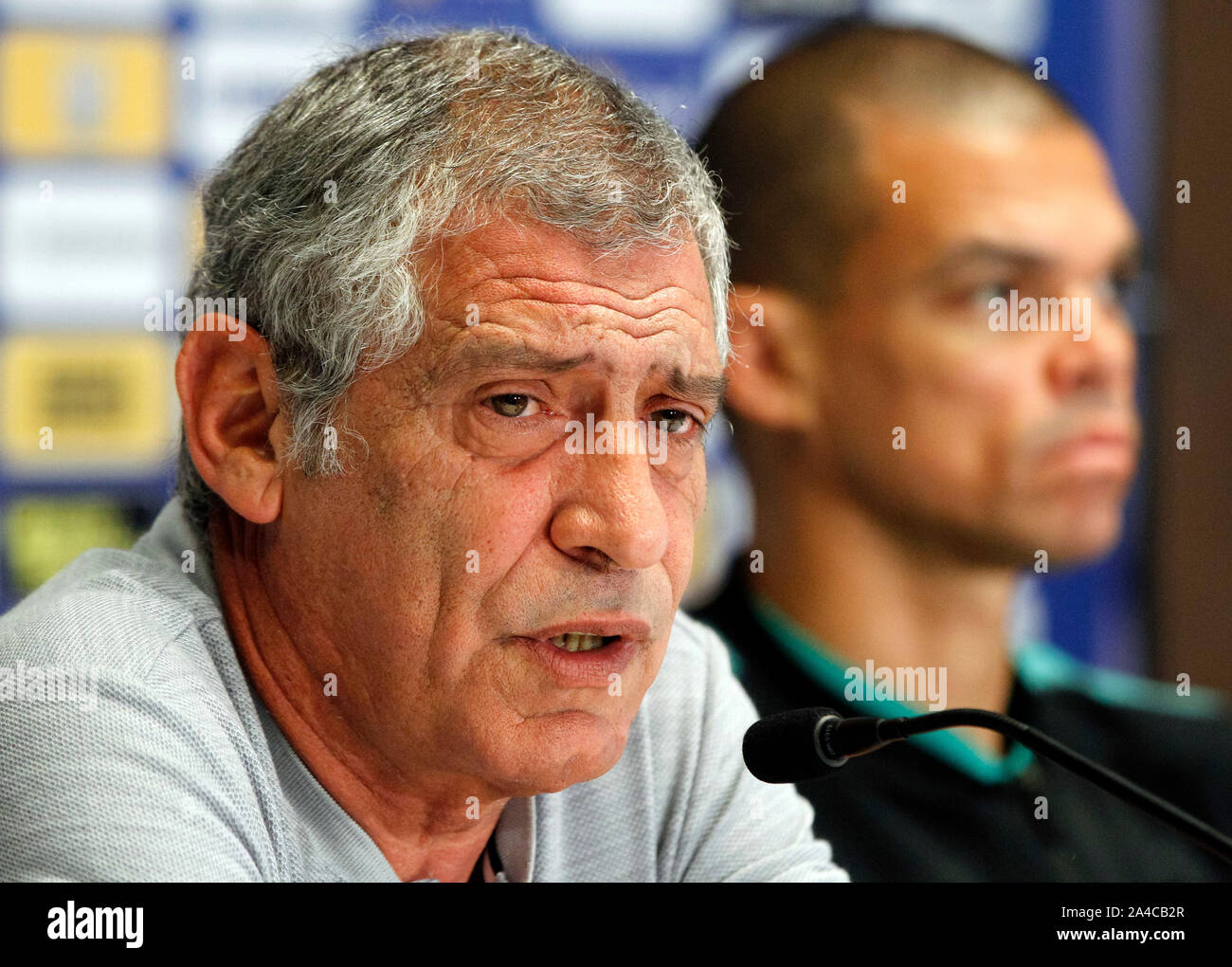 Kiev, Ukraine. 13th Oct, 2019. Portugal head coach Fernando Santos (L) and player Pepe (R) attend a press conference at the NSC Olimpiyskiy stadium in Kiev.Portugal and Ukrainian national teams face in the UEFA Euro 2020 qualifier football match on 14 October 2019. Credit: SOPA Images Limited/Alamy Live News Stock Photo