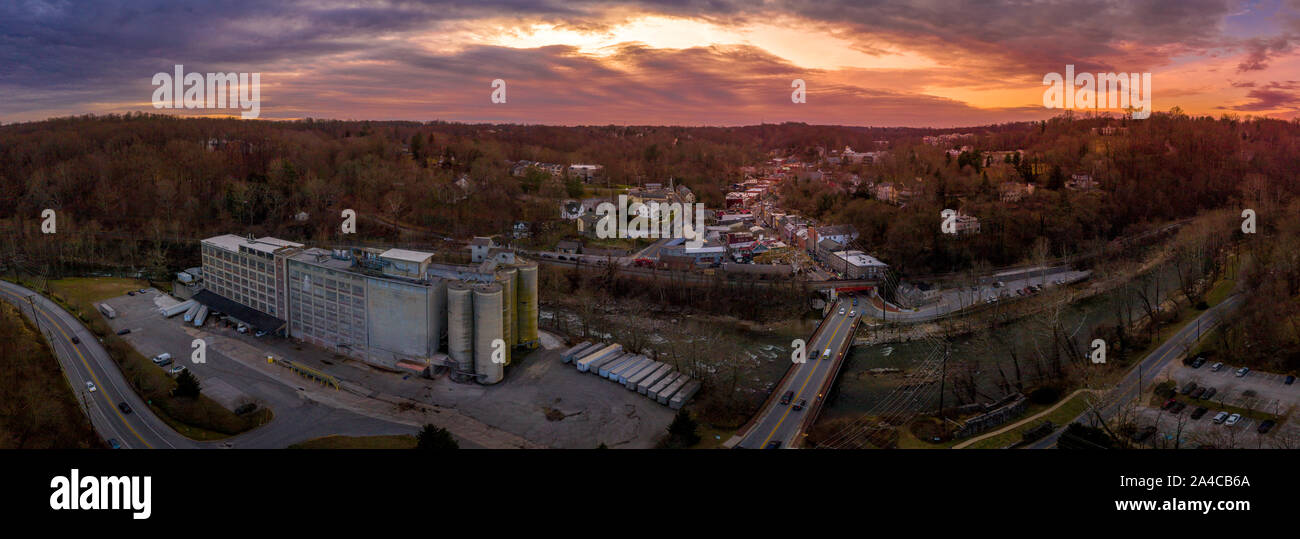 Sunset aerial panorama of Historic Old Ellicott City Maryland, USA typical civil war era small town with the oldest train station, rebuilding after de Stock Photo