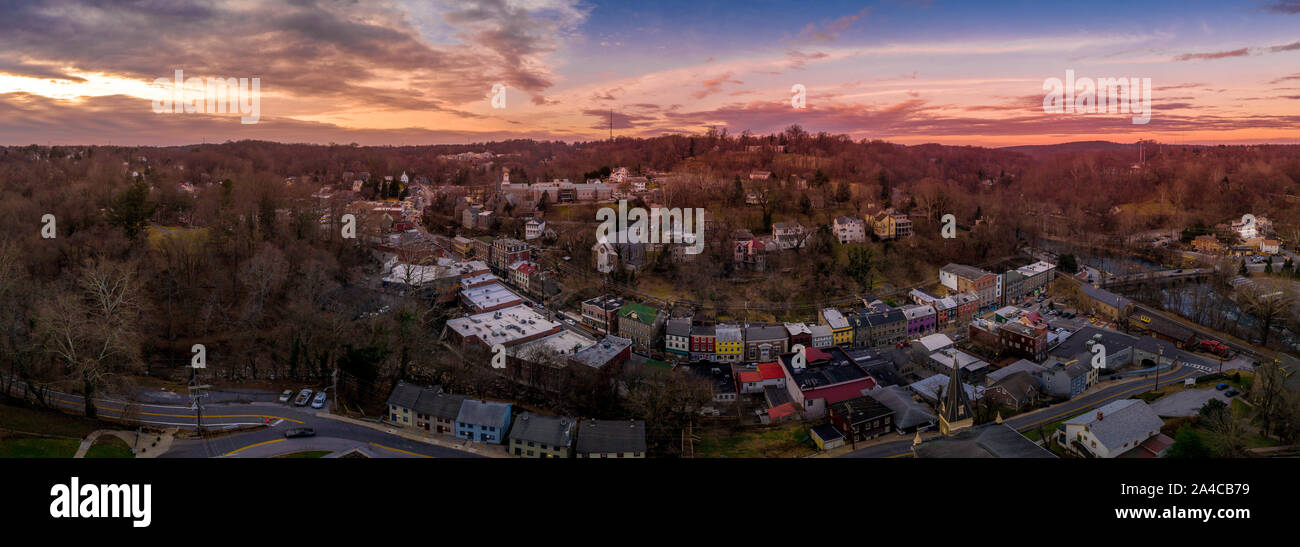 Sunset aerial panorama of Historic Old Ellicott City Maryland, USA typical civil war era small town with the oldest train station, rebuilding after de Stock Photo