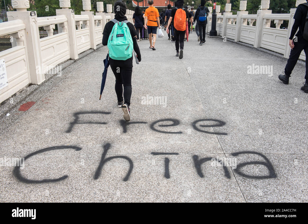 Hong Kong, China. 13th Oct, 2019. Protesters target the Chinese brands and corporations as well as the MTR subway network causing great damages all over the city during the demonstration.Hong Kong's government introduced an anti-mask law which bans people from wearing masks at public assemblies which sparked outrage among the public. Hong Kong has been shaken for over four months of massive anti-government demonstrations. Credit: SOPA Images Limited/Alamy Live News Stock Photo