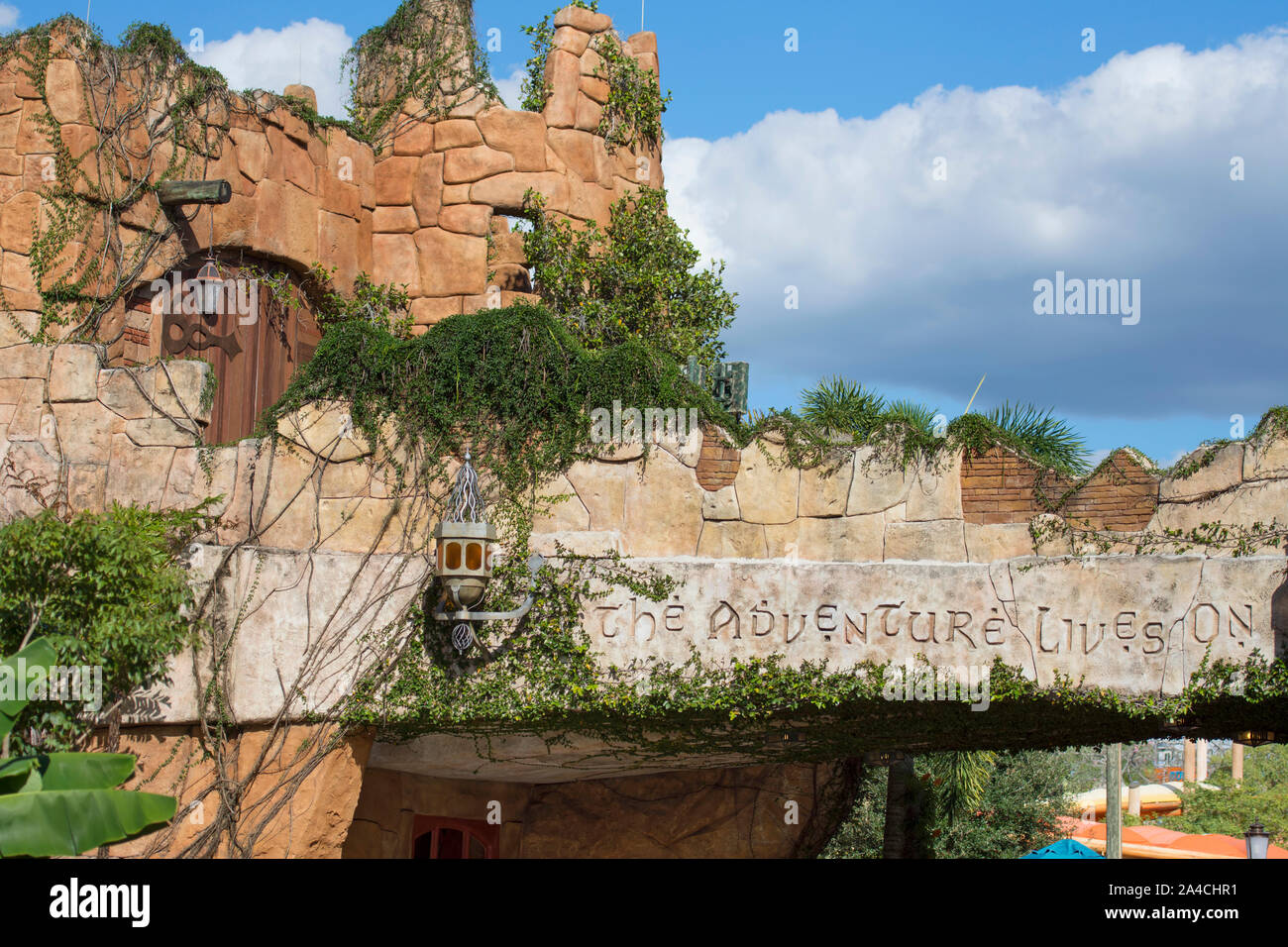 Islands of Adventure, The Adventure Lives On carved into rock,Park Exit Universal Studios Resort, Orlando, USA Stock Photo