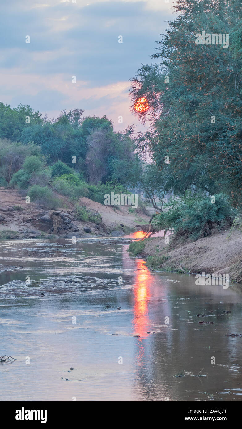 Sunrise over the Luvuvhu river in Pafuri region of the Kruger National Park in South Africa image with copy space Stock Photo