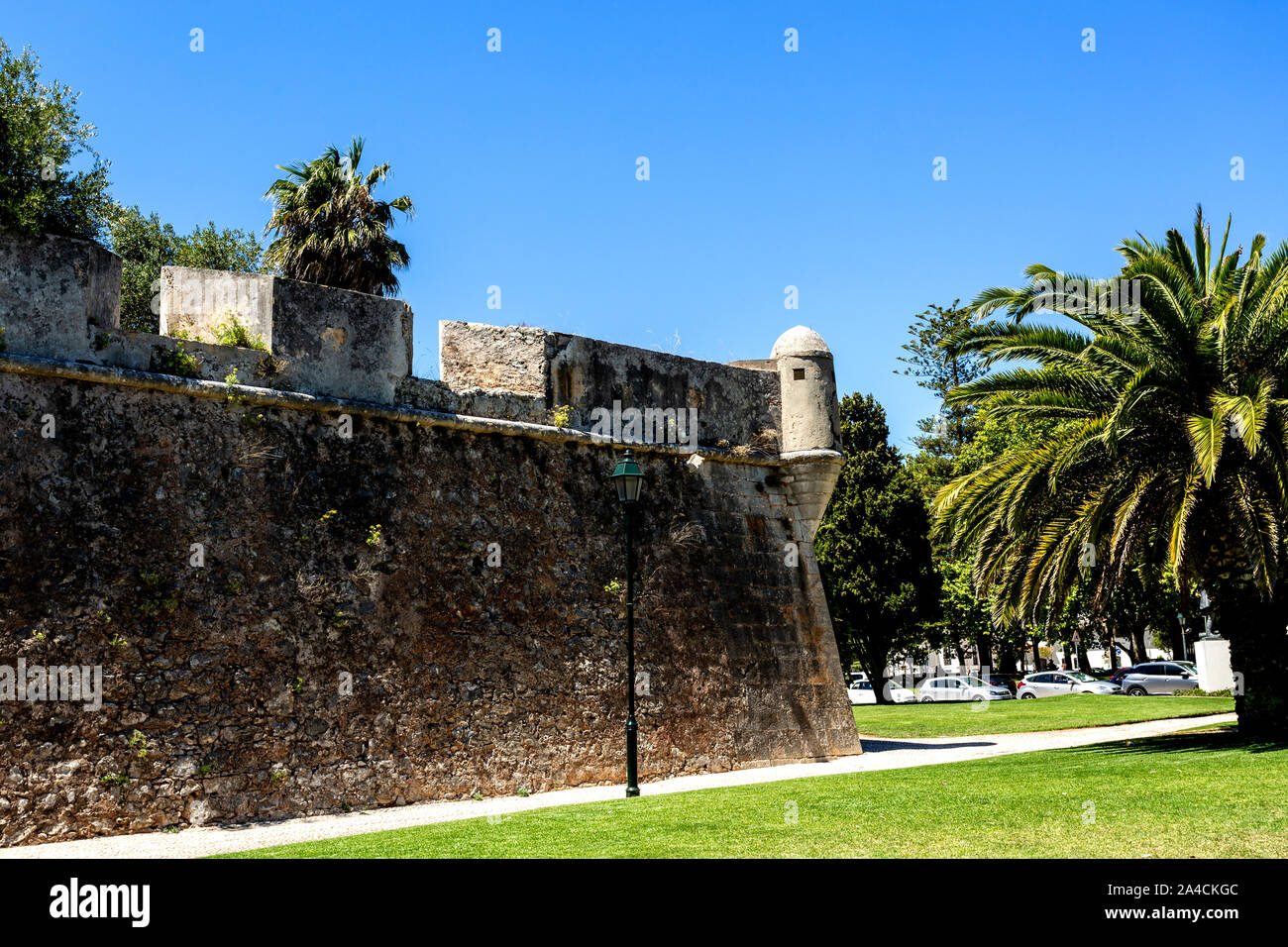 View of rampart wall and watchtower of the 16th century Citadel facing the town of  Cascais, Portugal Stock Photo