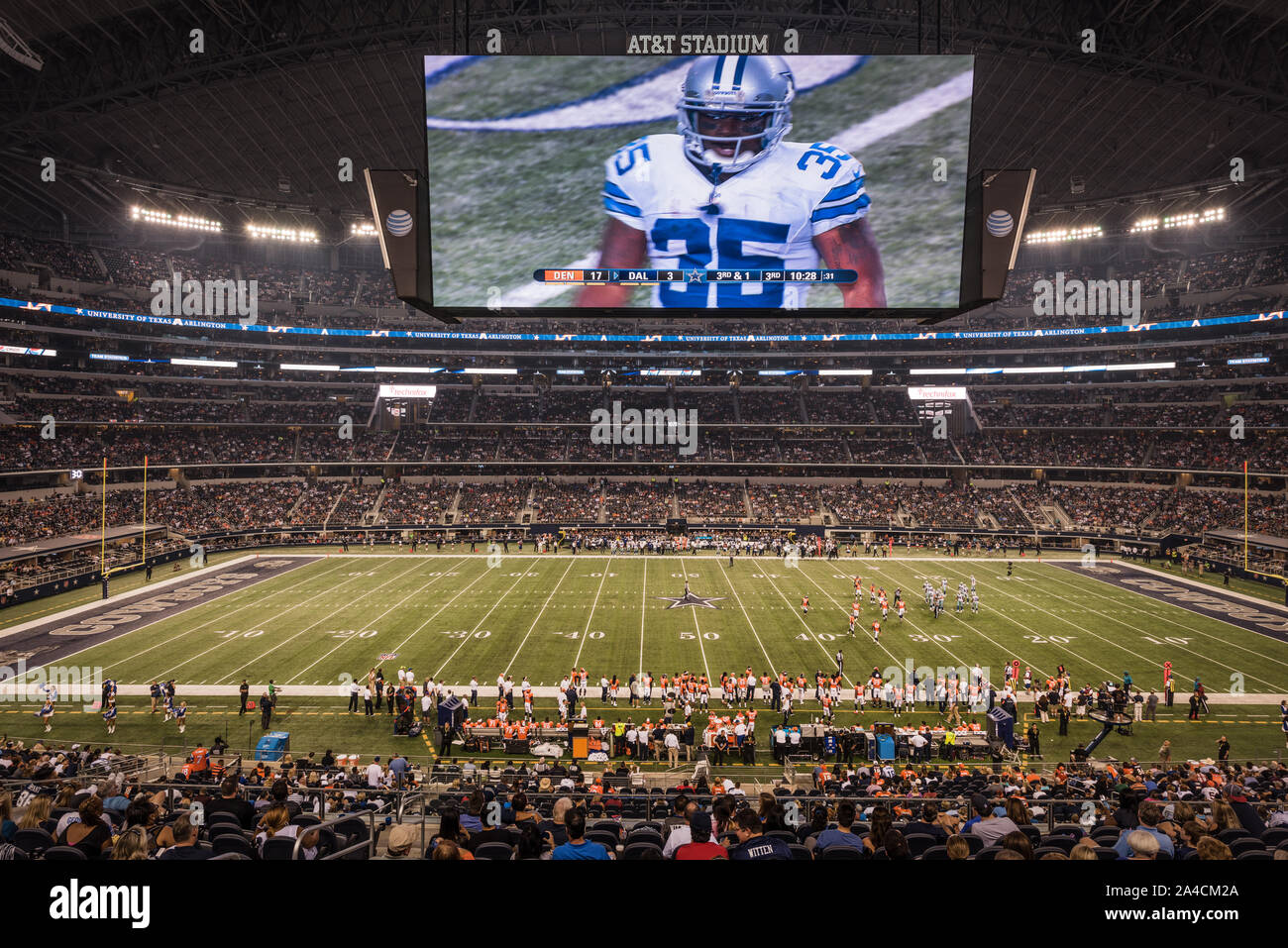 The enormous, high-definition video screen stretching from one 20-yard line to the other and weighing 1.2 million pounds, at the Cowboys' home field AT&T Stadium in Arlington, Texas, is so hard to miss that team employees say many fans watch the whole game on it, rather than by watching the live action on the field below Stock Photo