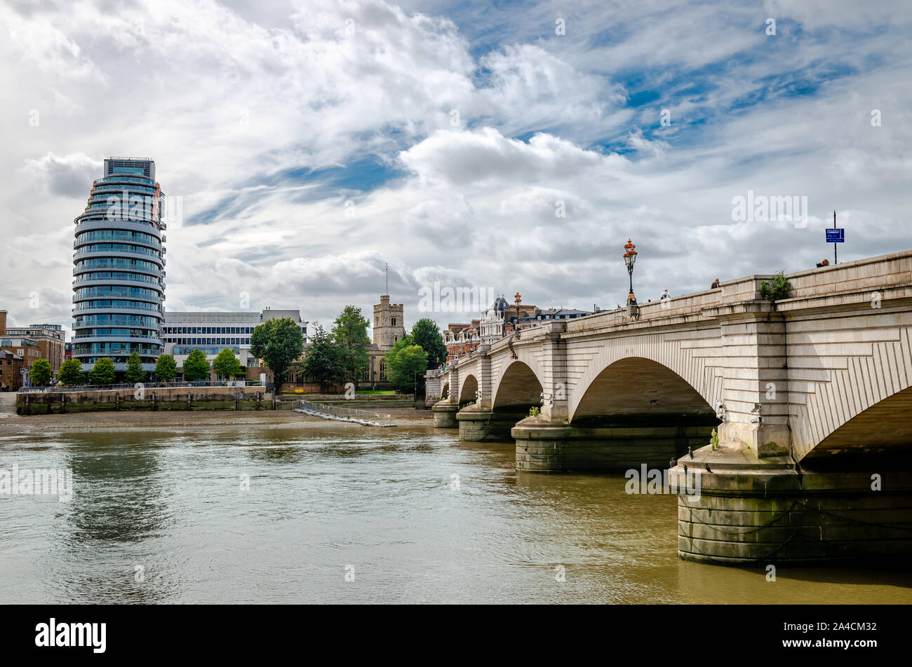 View of the Putney bridge with The St Mary's Church and the Putney Wharf Tower in the background. London, UK. Stock Photo