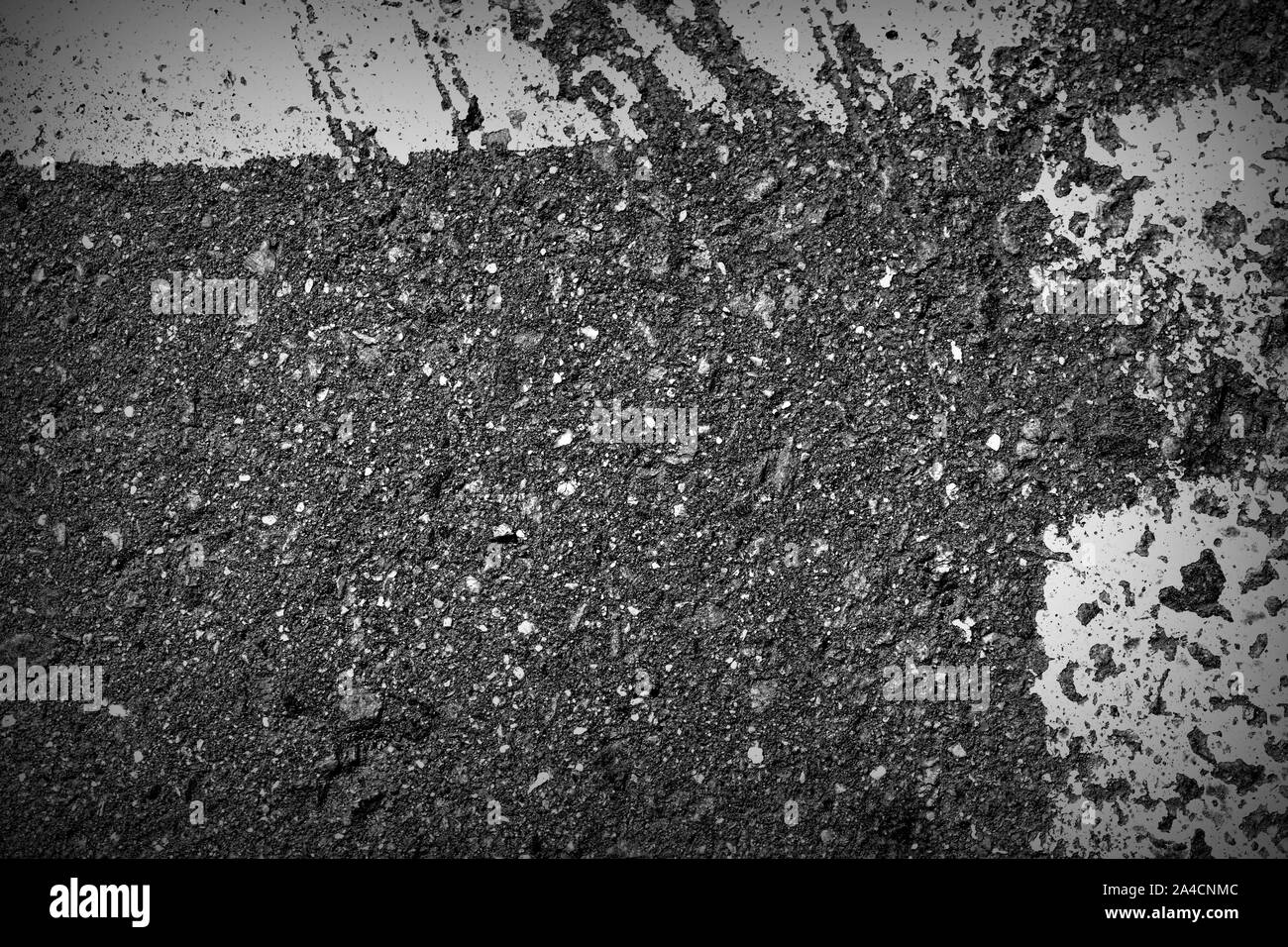 Old dirty asphalt texture with white paint on it. Top view Stock Photo