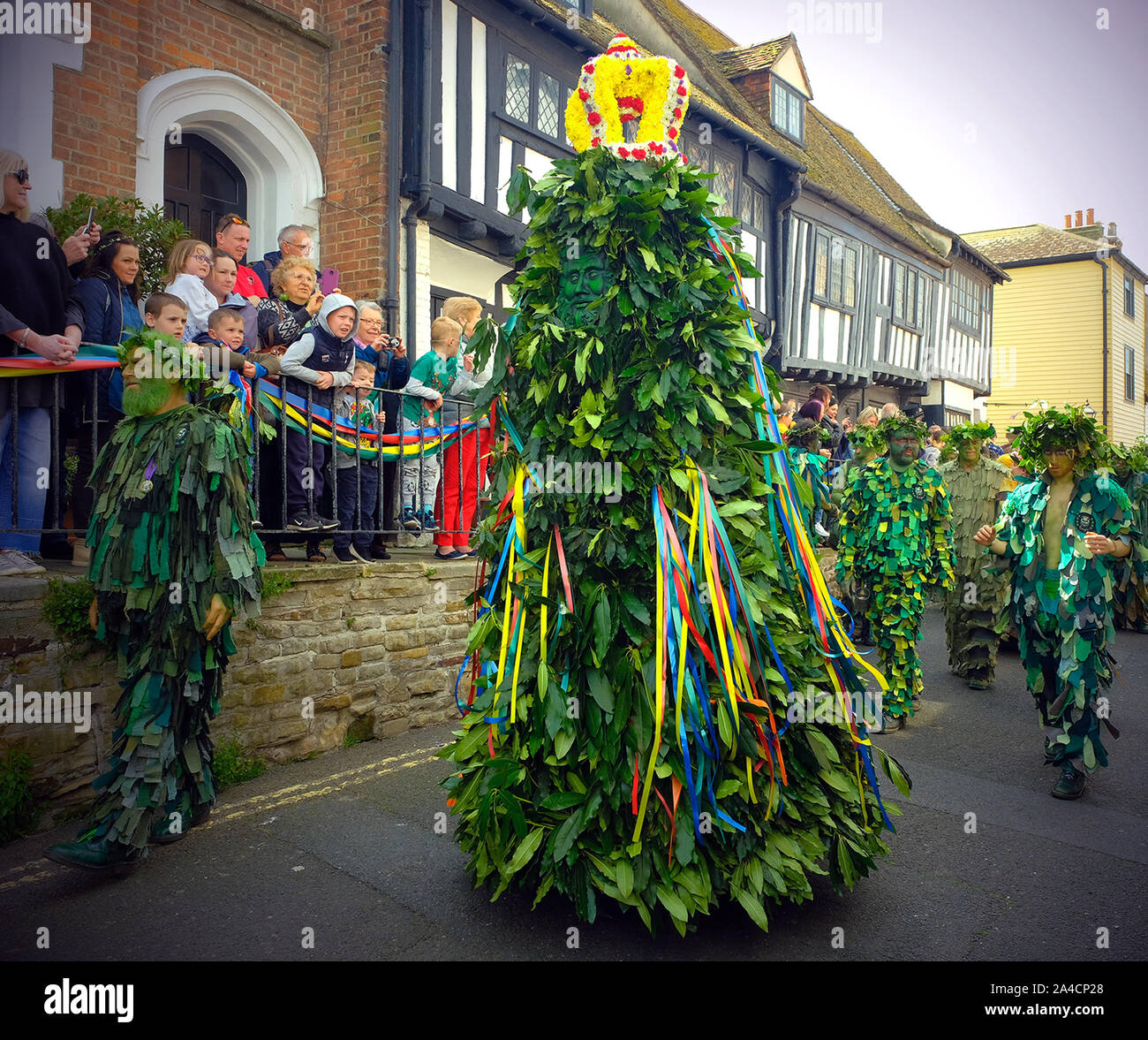 Jack in the Green, also known as Jack o' the Green, is an English folk custom associated with the celebration of May Day in Hastings, UK. It involves a pyramidal or conical wicker or wooden framework that is decorated with foliage being worn by a person as part of a procession, often accompanied by musicians. Stock Photo