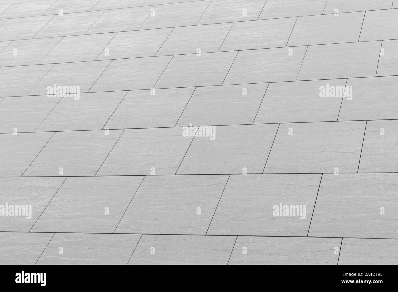 Diagonal view of gloomy gray wall with rectangular tile pattern Stock ...