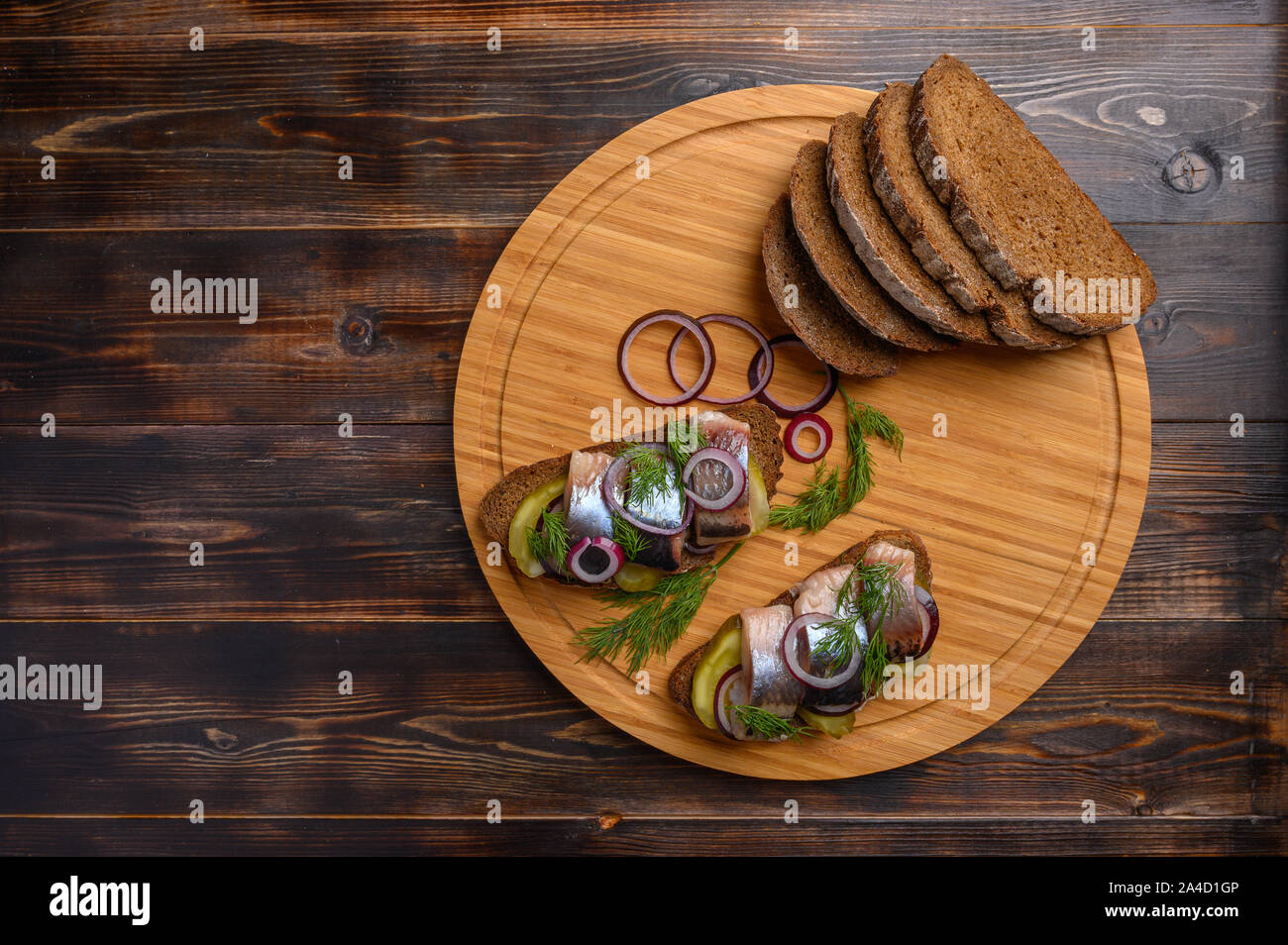 Nop view traditional Russian snack-sandwich with herring, bread and onions Stock Photo