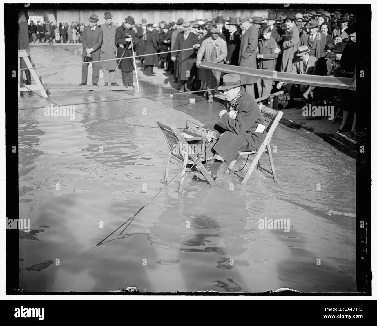 The incoming tide was not taken into consideration when official planned the christening of the giant flying boat Yankee clipper, at the U.S. Naval Station, Wash., D.C., As a result many of the sound engineers were marooned before Mrs. Roosevelt christened the ship, March 1939 Stock Photo