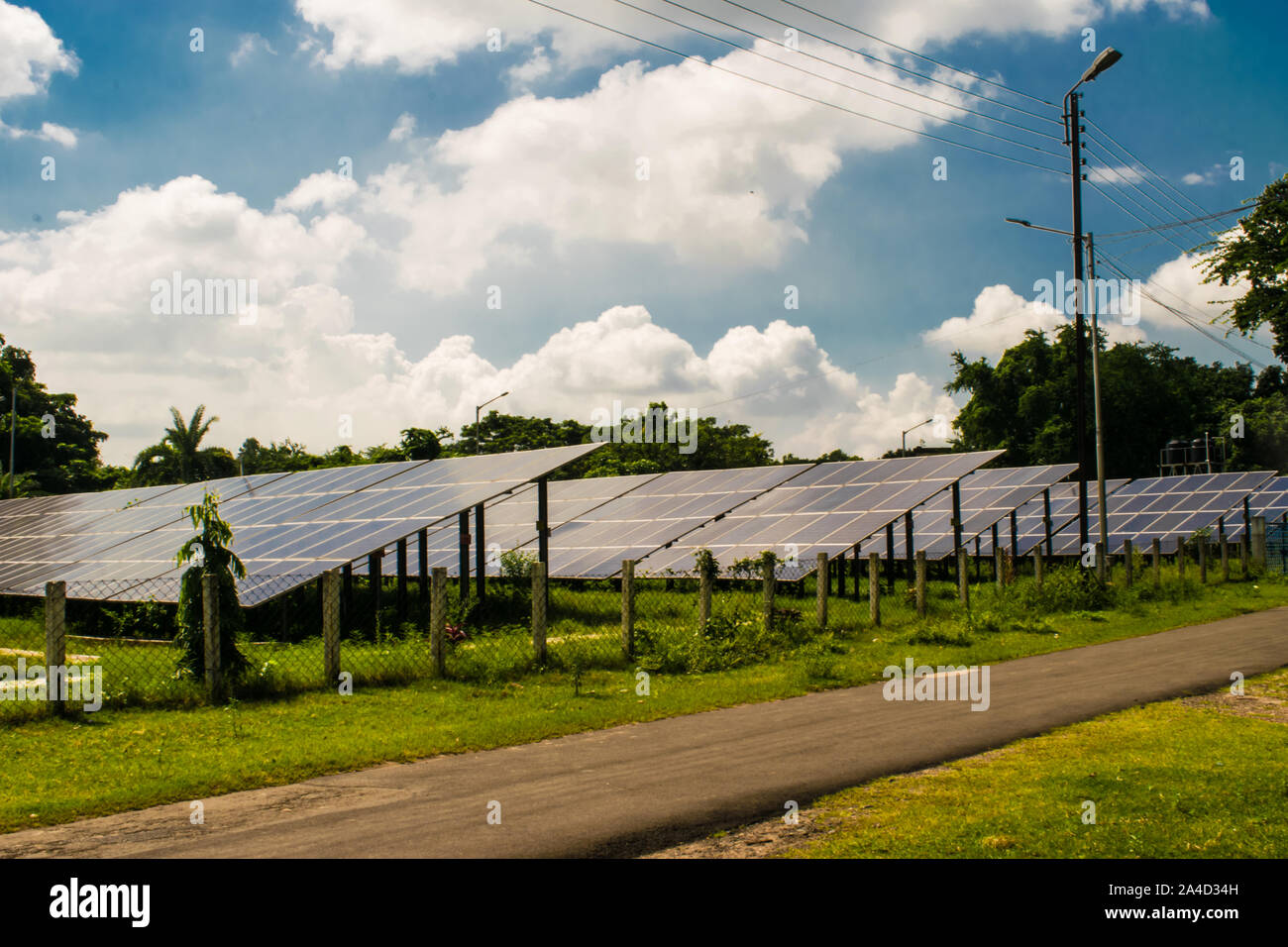 Solar Power Plant (PV array) with beautiful sky, WB, India. Stock Photo