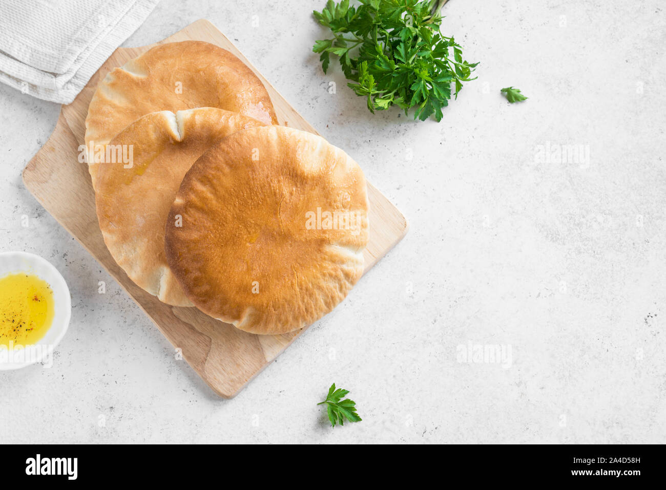 Indian Naan Flat Bread on white background, top view, copy space