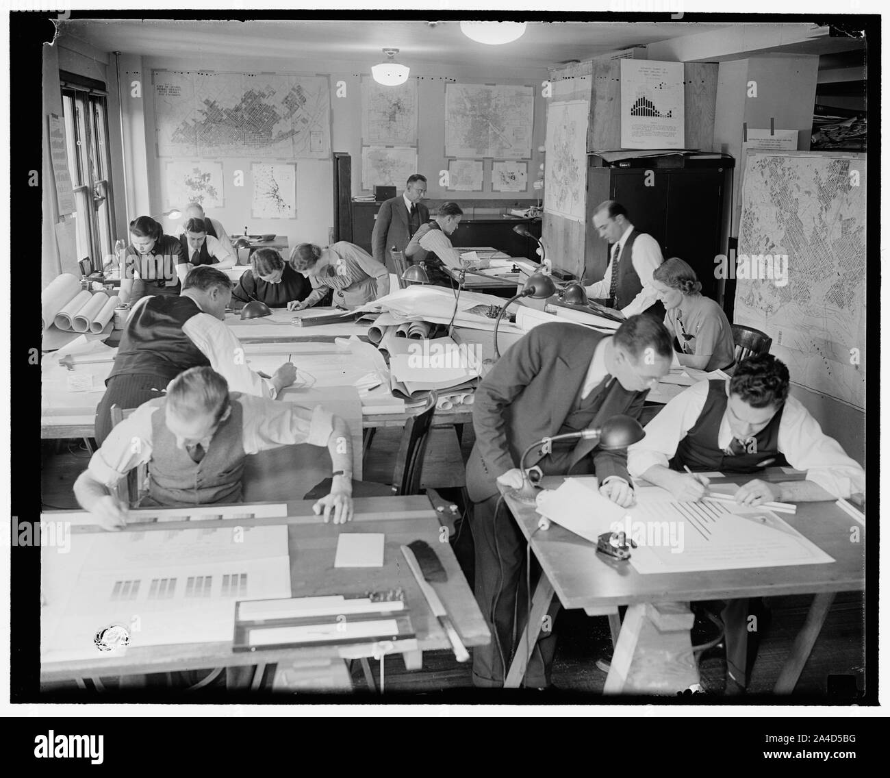 The mapping and drafting section of the Division of Economics and Statistics visualizes information on housing and mortgage lending conditions, in some cases for country as a whole and in others by as small a geographical unit as the city block Stock Photo