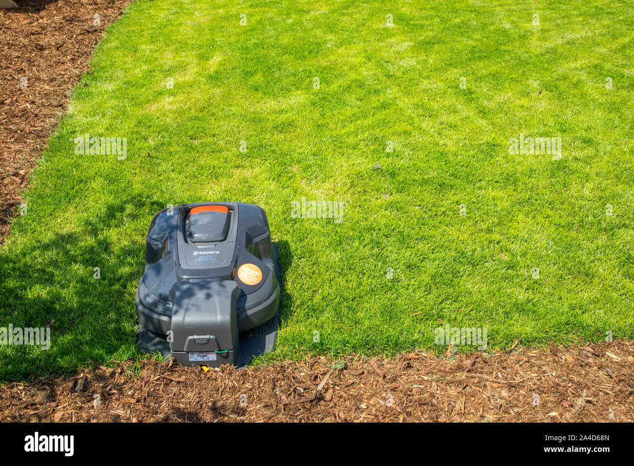 Lawn mower robot, from Husqvarna, automatically mows the lawn, Stock Photo