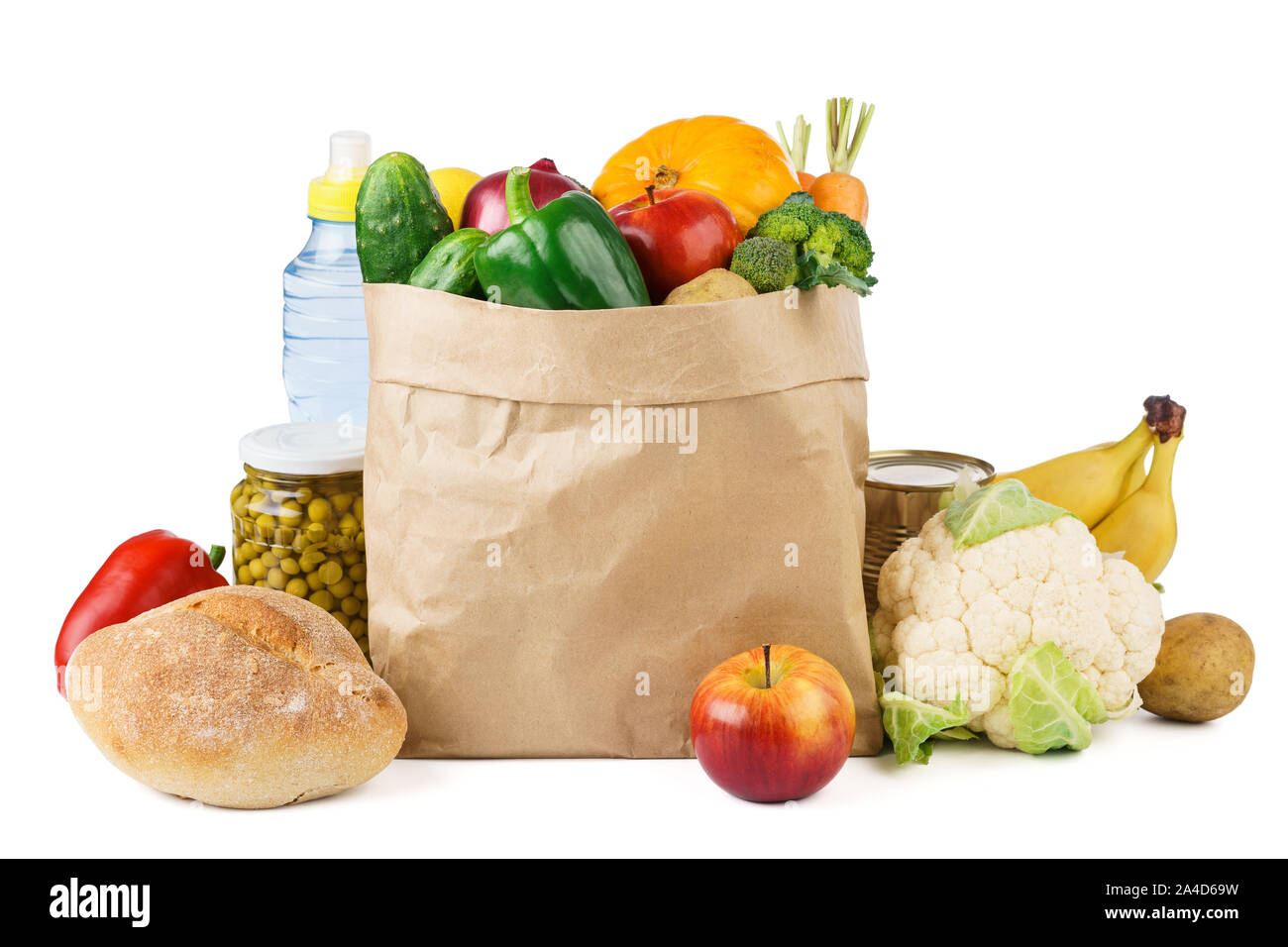 Paper bag full of various groceries - fresh fruits and vegetables, bread. Food delivery concept. Stock Photo