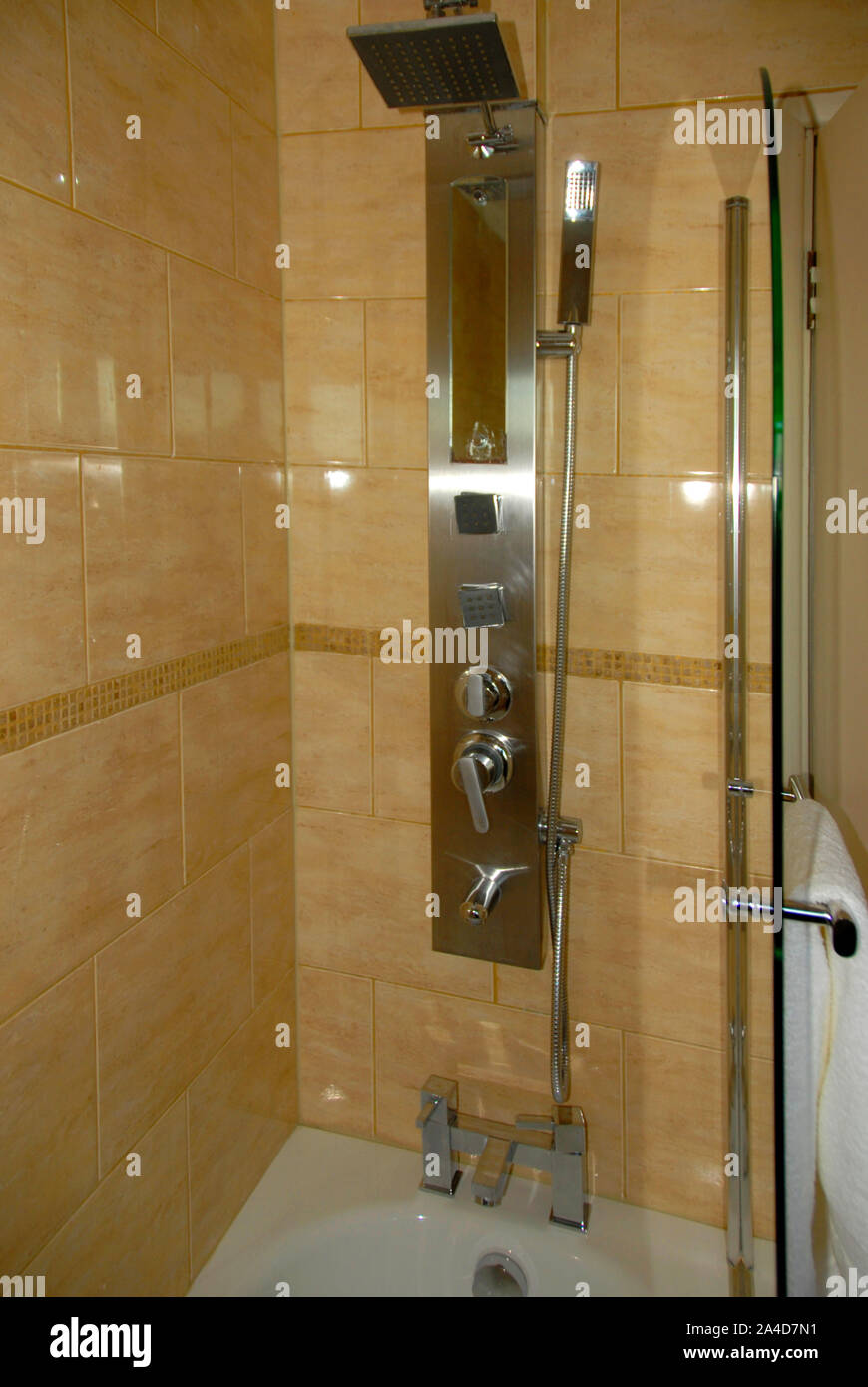 Modern over-bath shower, with complicated operating system needing instructions, in hotel Stock Photo