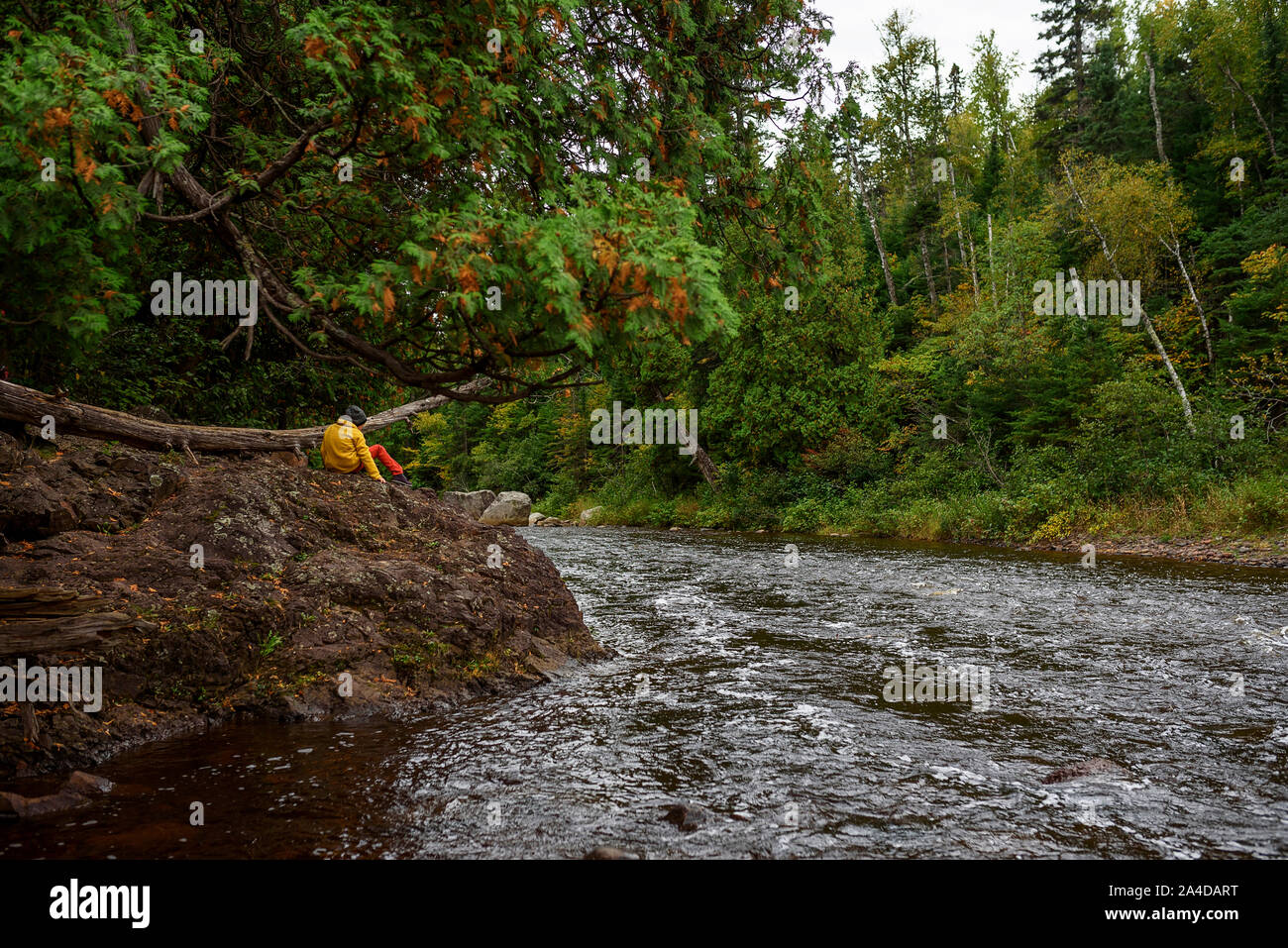 Boys sitting on rock river hi-res stock photography and images - Alamy