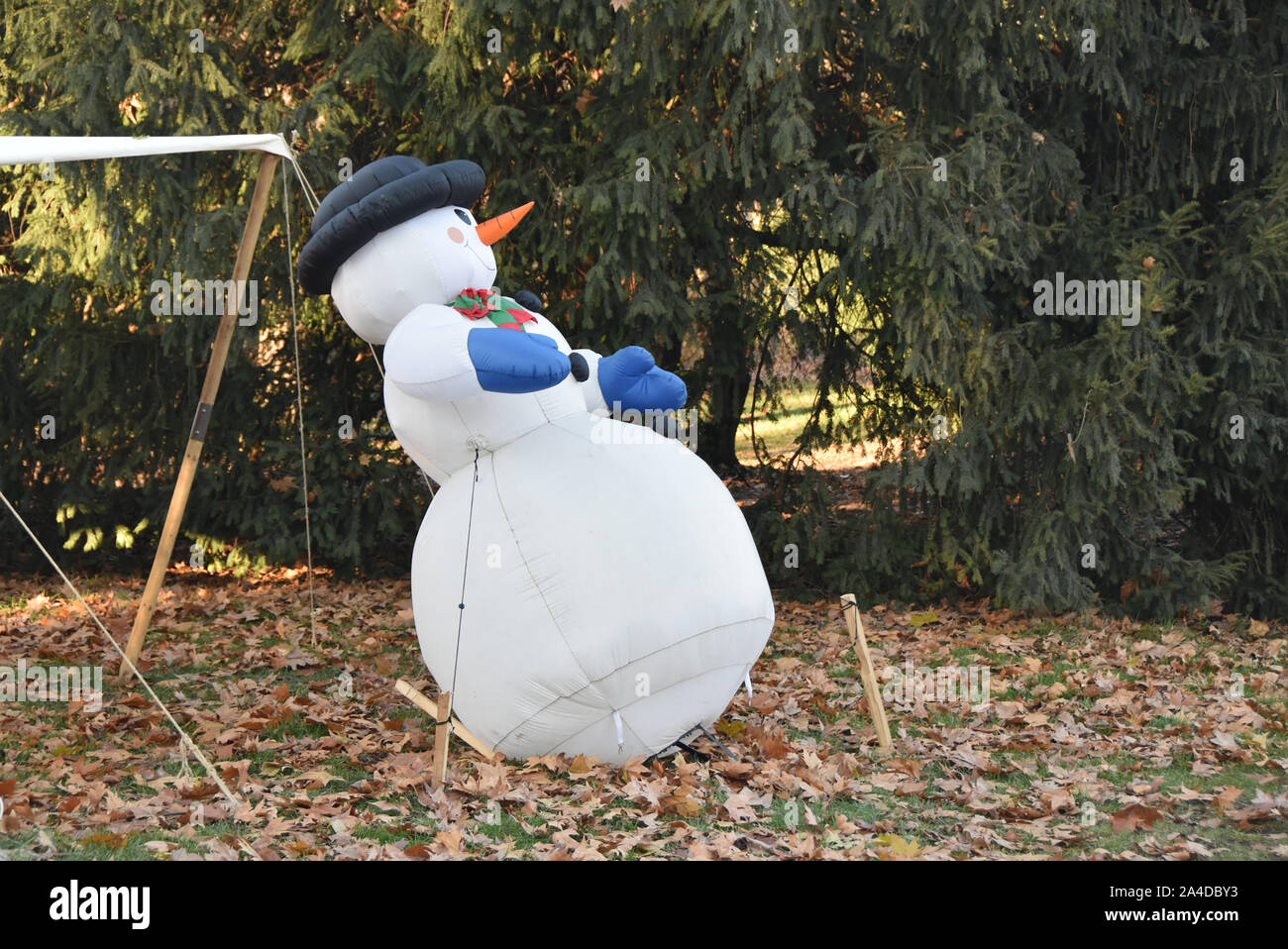 Inflatable snowman in an autumn garden, Piedmont, Italy Stock Photo