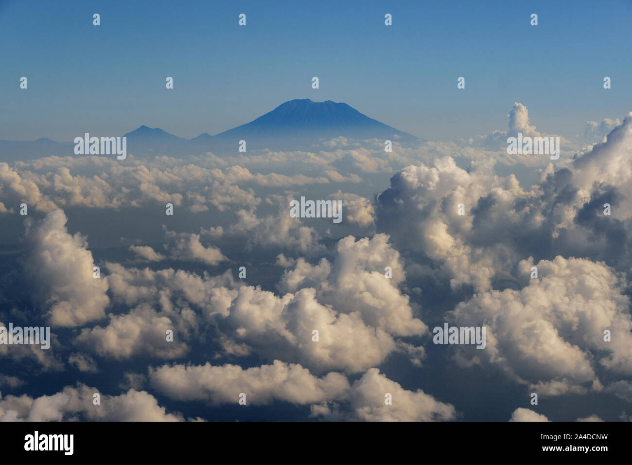 Mount Agung through the clouds, Bali, Indonesia Stock Photo