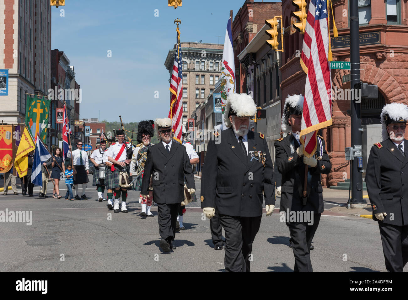 The procession winds its way through downtown Clarksburg at the annual North Central West Virginia Scottish Festival and Celtic Gathering parade that ends with a celebration at Clarksburg's First Presbyterian Church Stock Photo