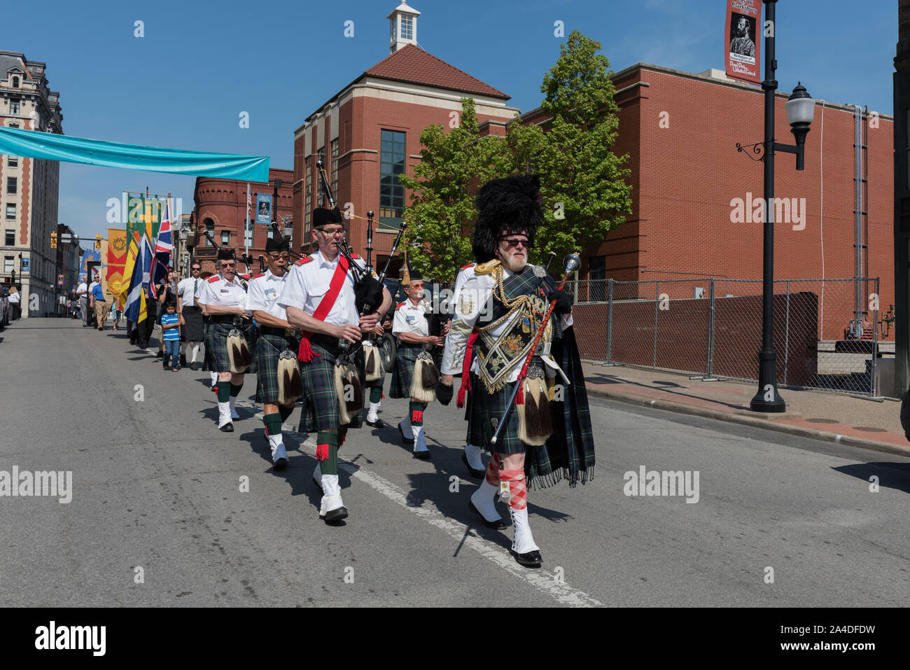 The procession winds its way through downtown Clarksburg at the annual North Central West Virginia Scottish Festival and Celtic Gathering parade that ends with a celebration at Clarksburg's First Presbyterian Church Stock Photo