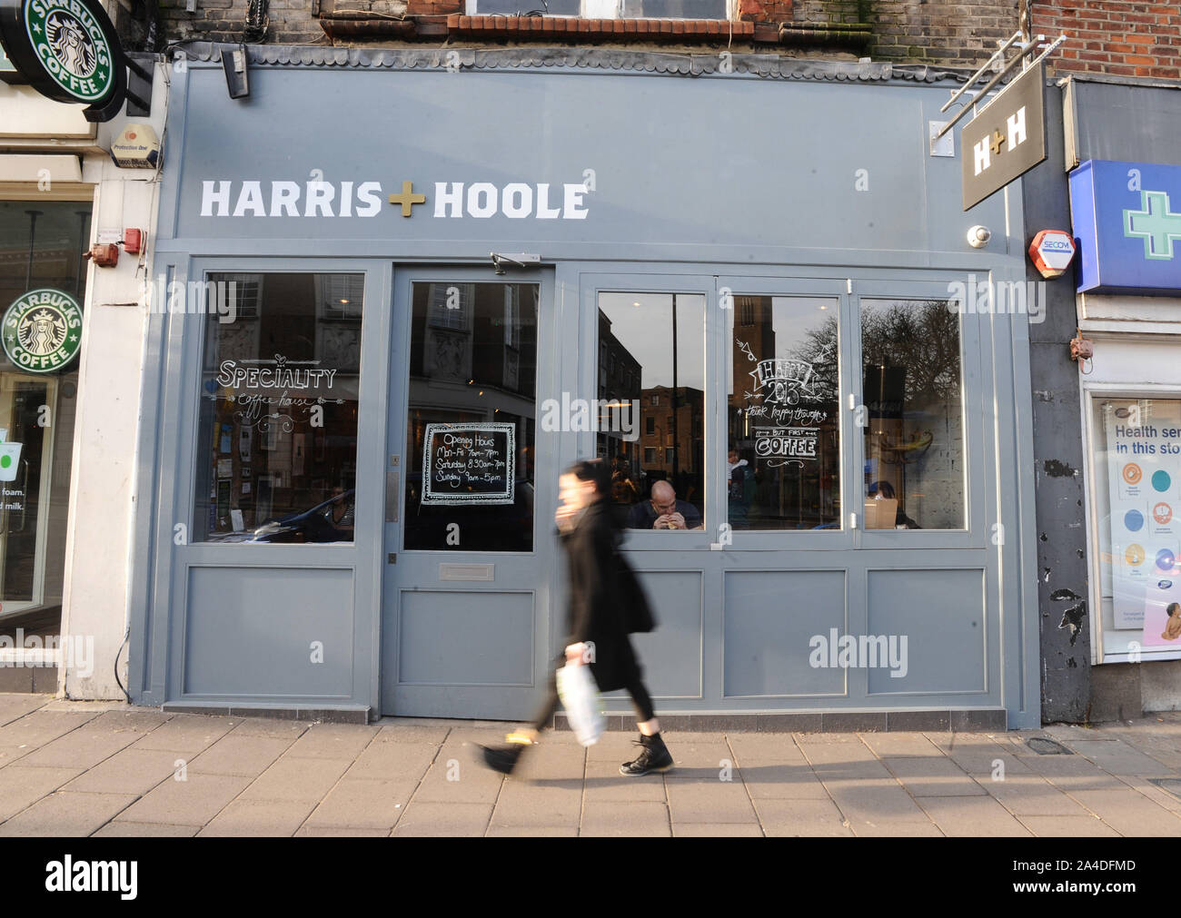 Photo Must Be Credited ©Kate Green/Alpha Press 076006 08/01/13 Harris + Hoole Coffee Shop in Crouch End High Street, North London. Harris + Hoole is the brainchild of three siblings - Nick, Andrew and Laura Tolley. Their vision is to bring great tasting speciality coffee to the high street. Not an easy mission for three individuals, but having already set up eight Taylor St. Baristas shops across London and Brighton since 2006, they know how to brew a great tasting cup of coffee. But to be able to provide the high street with fantastic coffee takes investment and backing, and few people know t Stock Photo