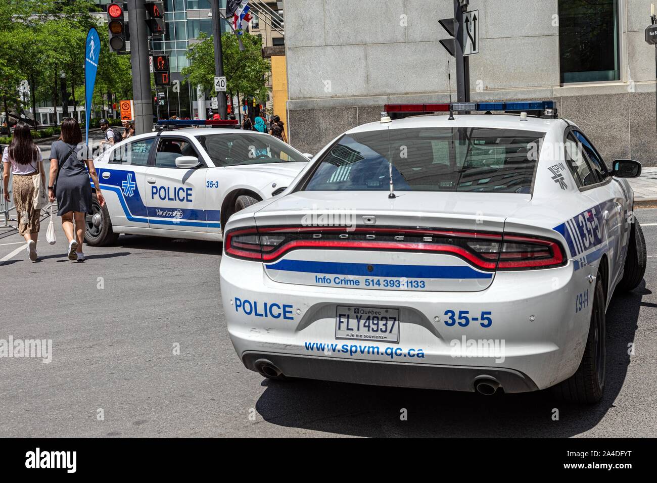 POLICE CARS IN FRONT OF VICTORIA SQUARE, MONTREAL, QUEBEC, CANADA Stock