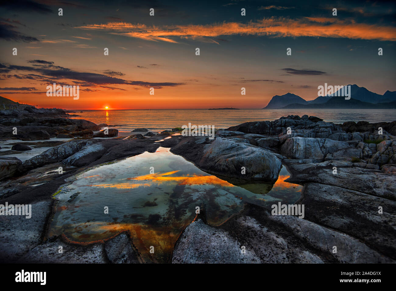 Midnight sunset at Sandnes, Flakstad, Lofoten, Nordland, Norway Stock Photo