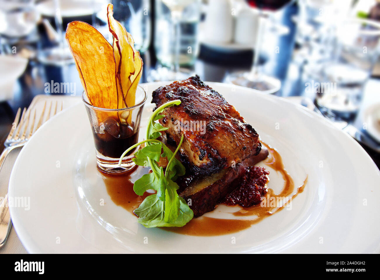 Roasted loin of beef with potato wedges Stock Photo Alamy