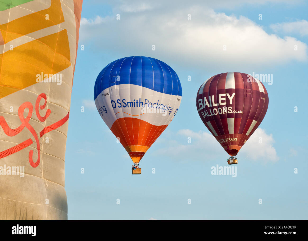 Hot air balloons floating away from launch field. Bristol International Balloon Fiesta, England. Stock Photo