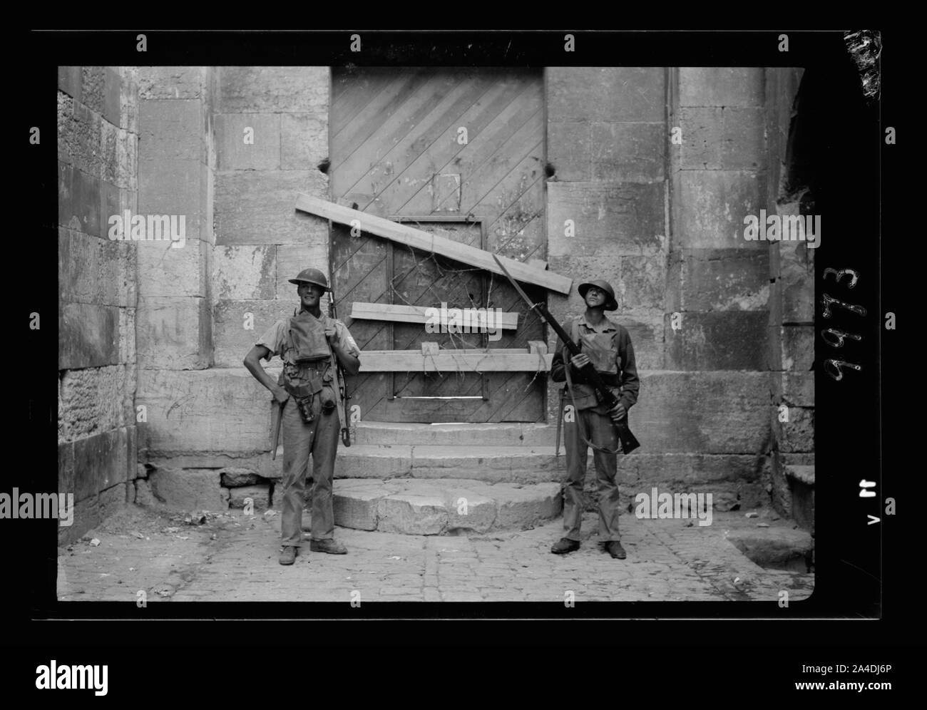 The raising of the siege of Jerusalem. Typical scene of troops in Old City before the lifting of curfew, an entrance into the Temple Area closed with timbers & barbed wire & guarded by troops Stock Photo