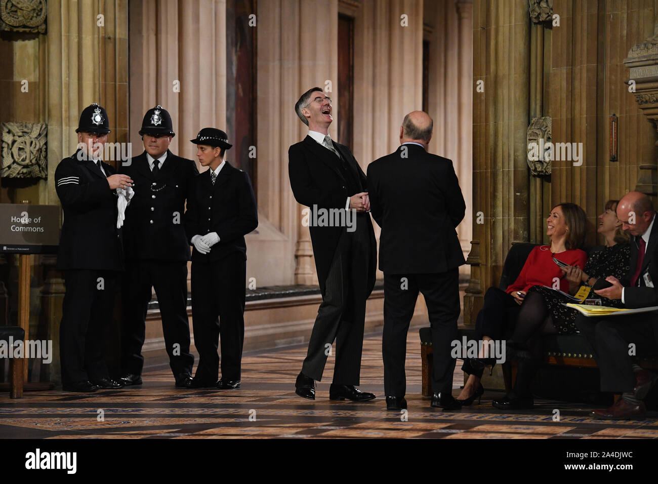 Leader of the House of Commons Jacob Rees-Mogg (centre) in the Central Lobby after members of parliament were summoned to listen to the Queen's Speech during the State Opening of Parliament ceremony in London. Stock Photo
