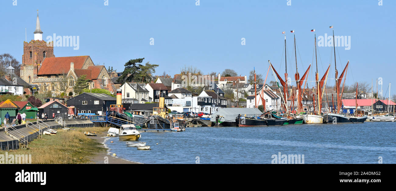 Maldon Essex panoramic riverside quay & urban landscape skyline blue sky day masts of Thames barges moored on the tidal River Blackwater England UK Stock Photo