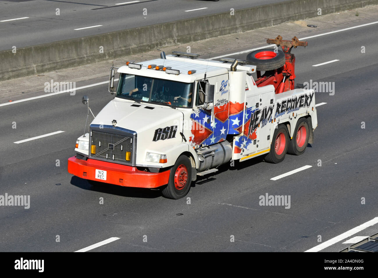 Front & side of Volvo breakdown heavy lifting lorry truck recovery breakdown service for UK European lorries and trucks driving along M25 motorway Stock Photo