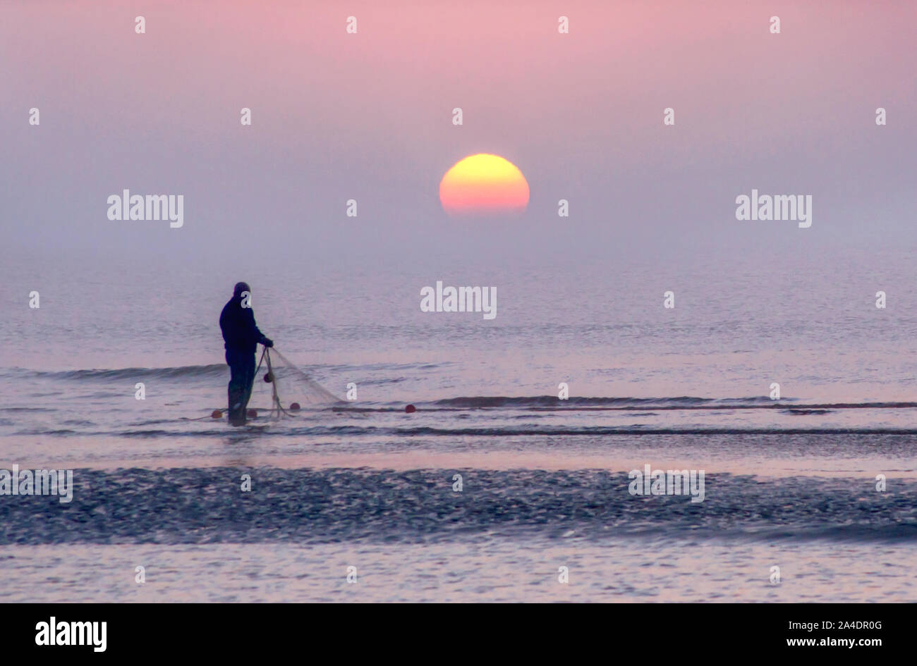 early morning fisherman Stock Photo