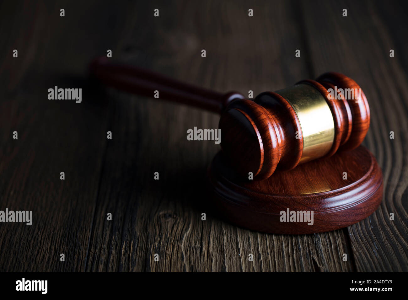 Antique gavel on the table. Law, auction and business concept. Place for logo or text. Stock Photo