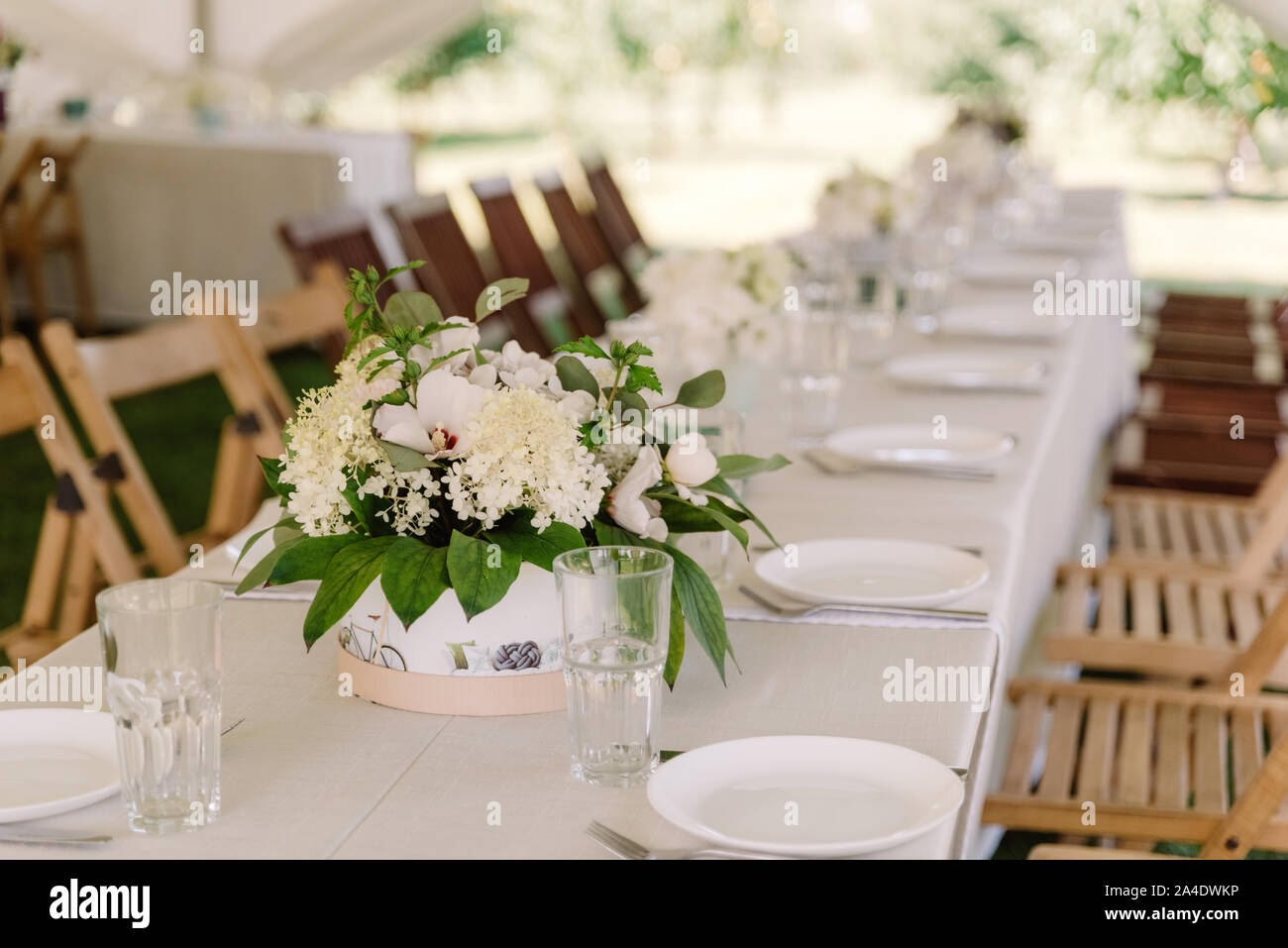 Serving tables for guests at the wedding stylish dishes and cutlery