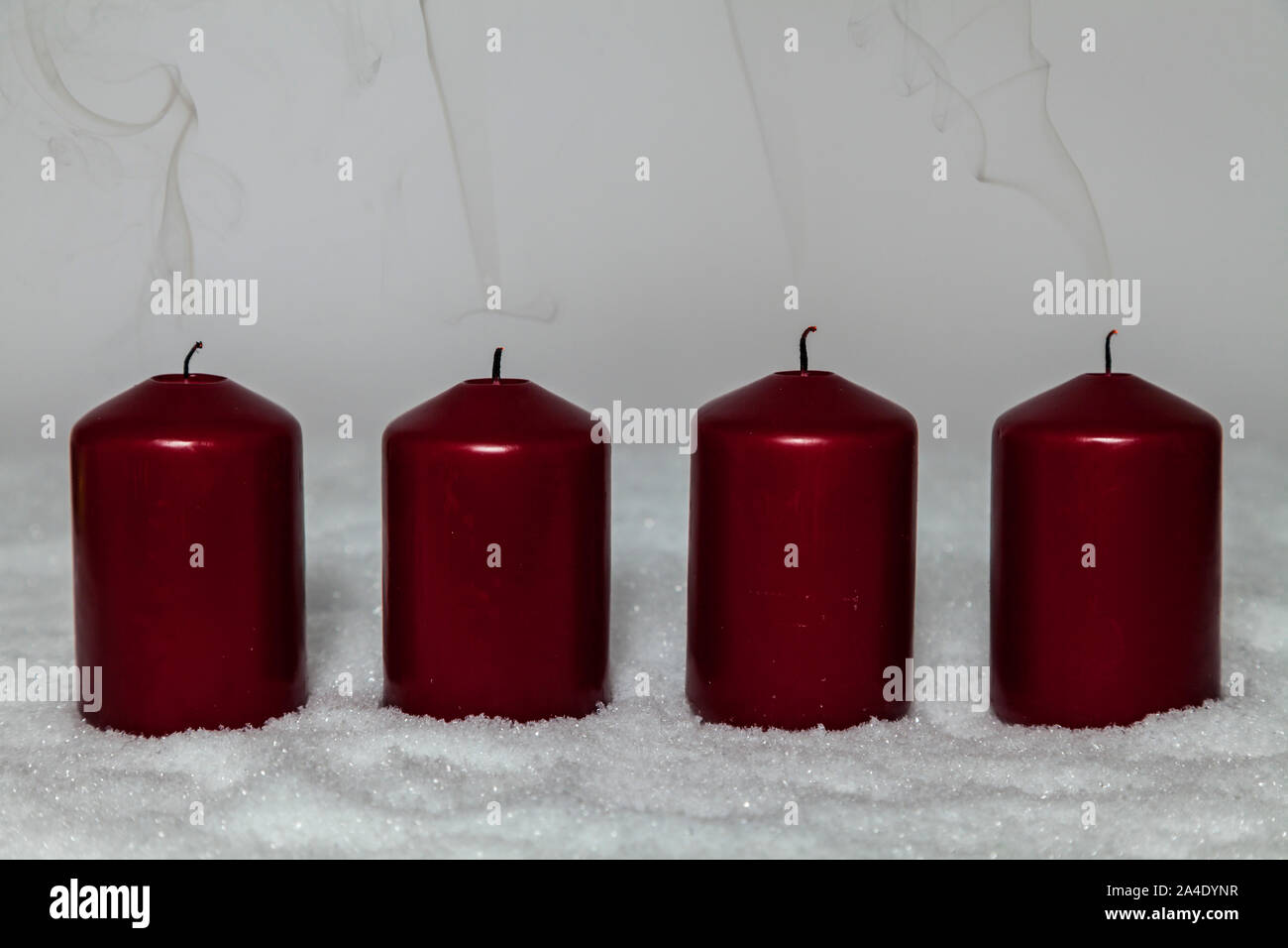 Advent candles made from granulated wax, wick and glass cylinders.