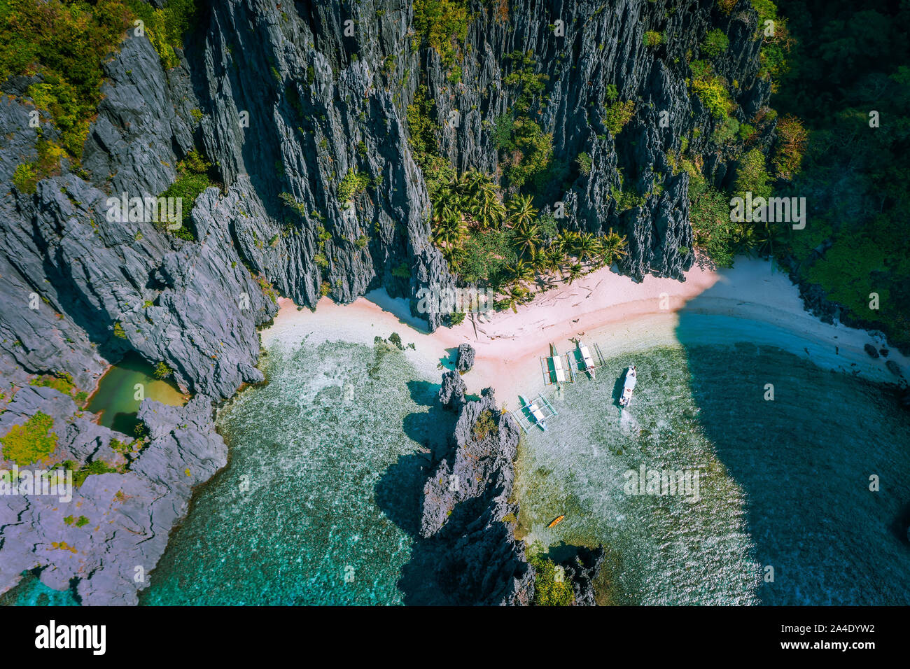 El Nido, Palawan, Philippines. Aerial view of Secret hidden lagoon beach with tourist banca