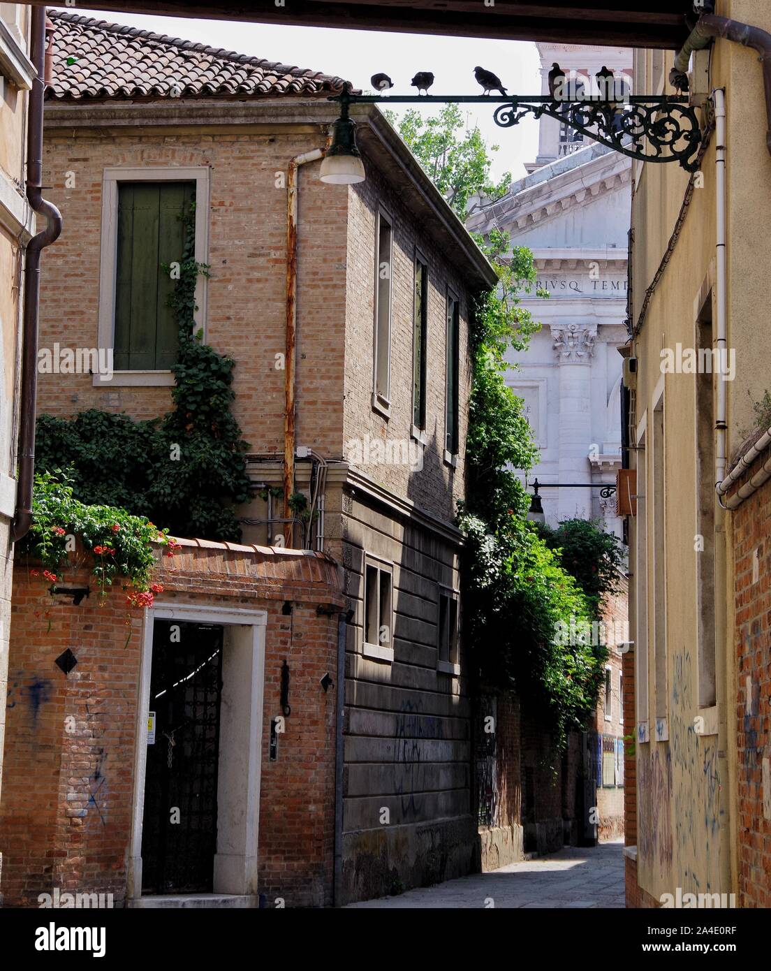 A view along a back street in the Sestiere of Castello, Venice. Looking towards the San Francesco Della Vigna Catholic Church. Stock Photo