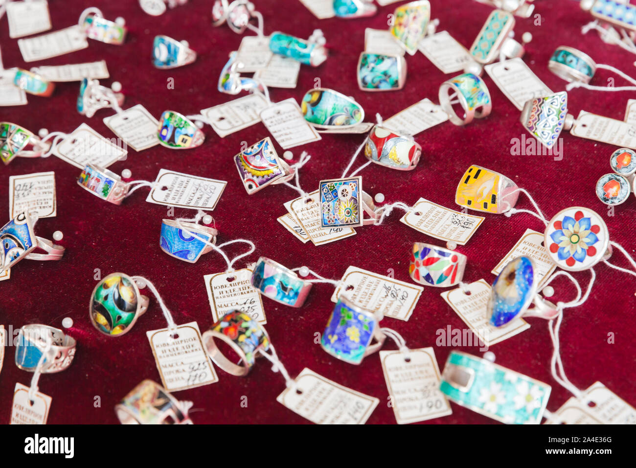Tbilisi, Georgia - April 28, 2019: Collection of handmade jewelry made by Minankari or cloisonne enamel is on a counter of local shop. This jewelry te Stock Photo