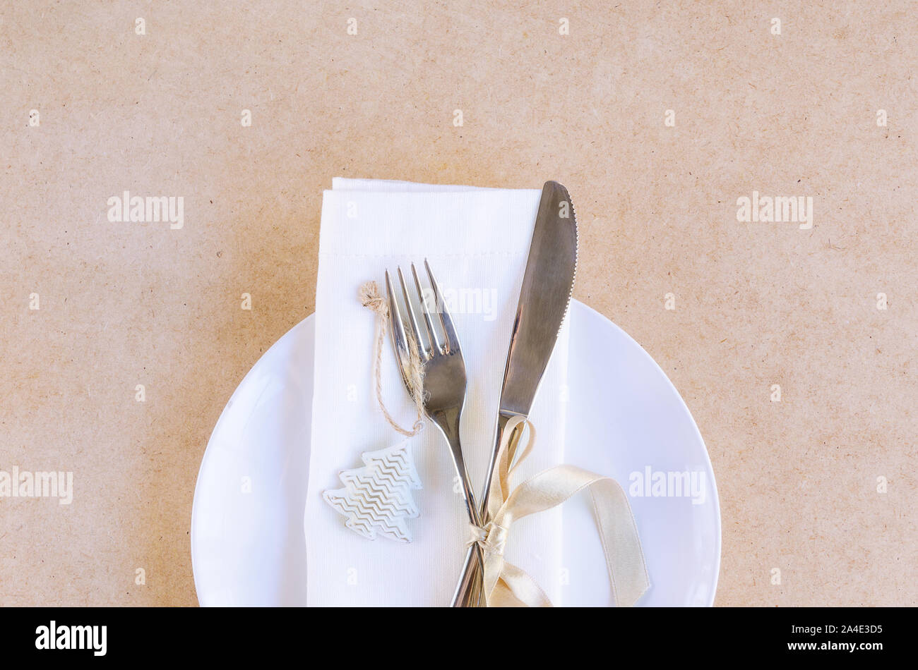 Beautiful Decoration For Festive Dinner In Beige White Tone Christmas Table Settings White Napkin With Silver Cutlery And Christmas Tree Toy On Cra Stock Photo Alamy