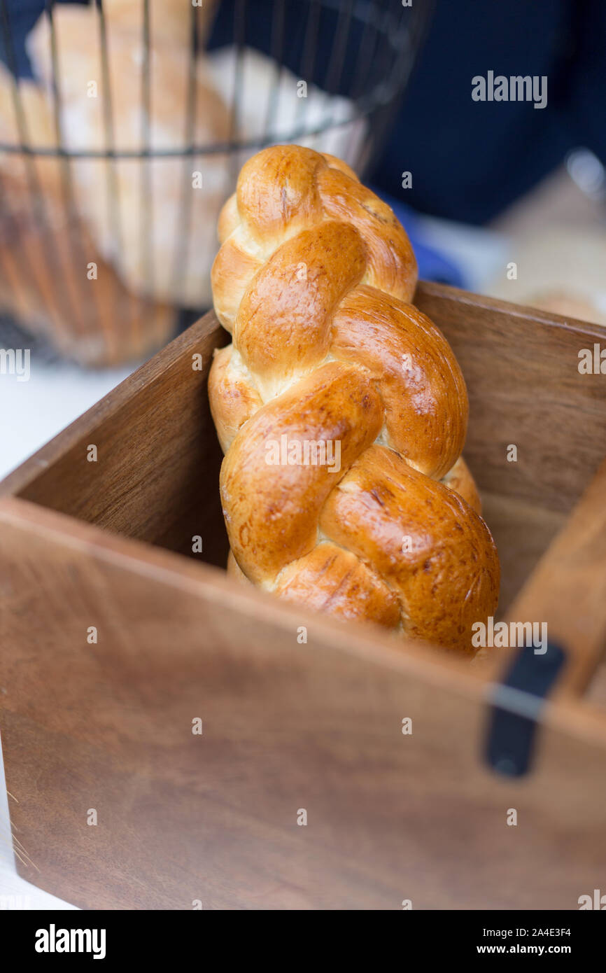 French bread on wooden box. Concept of street food market. Stock Photo